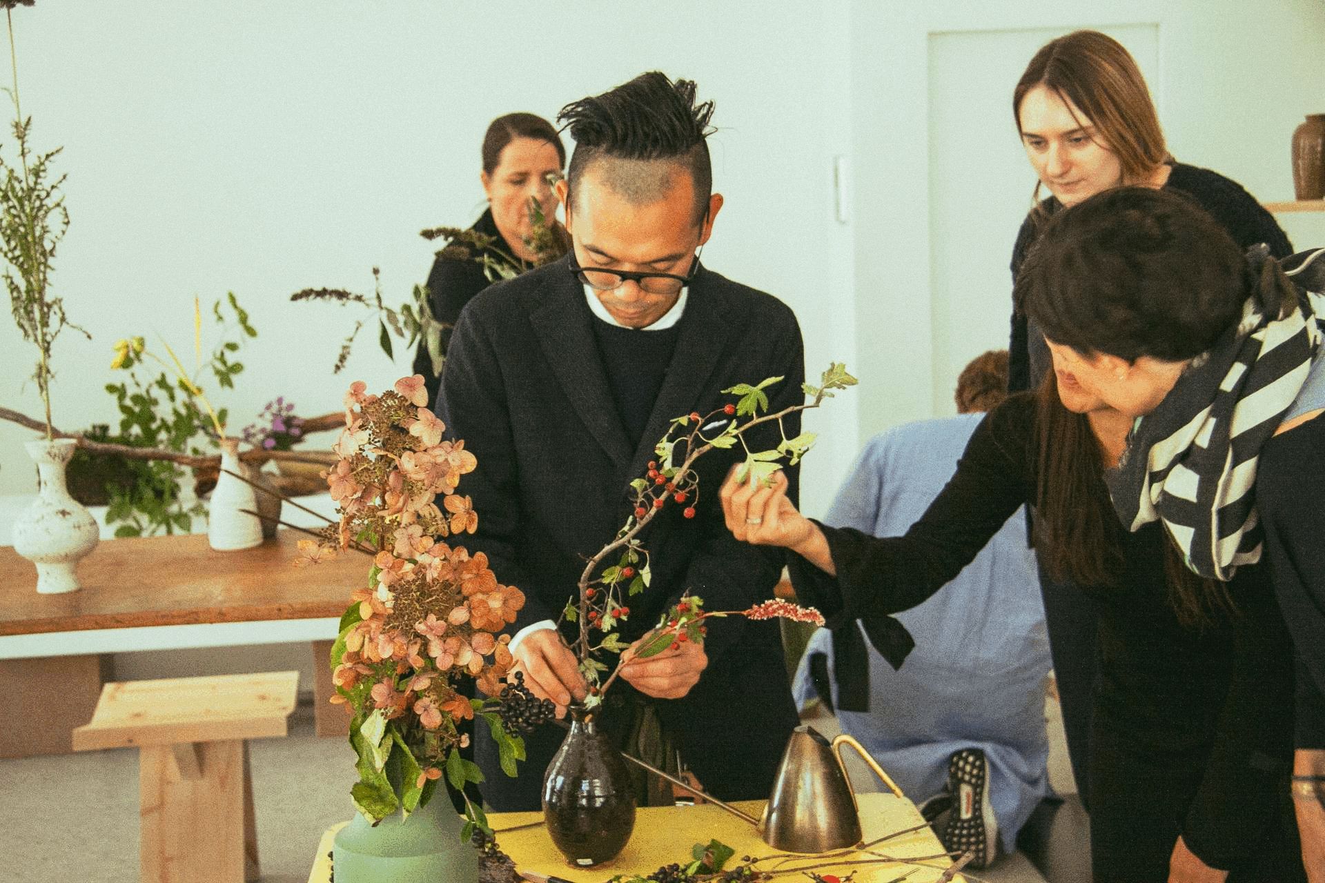 a slideshow featuring the hosted ikebana Artist Toru Watarai as he is creating an ikebana artwork
