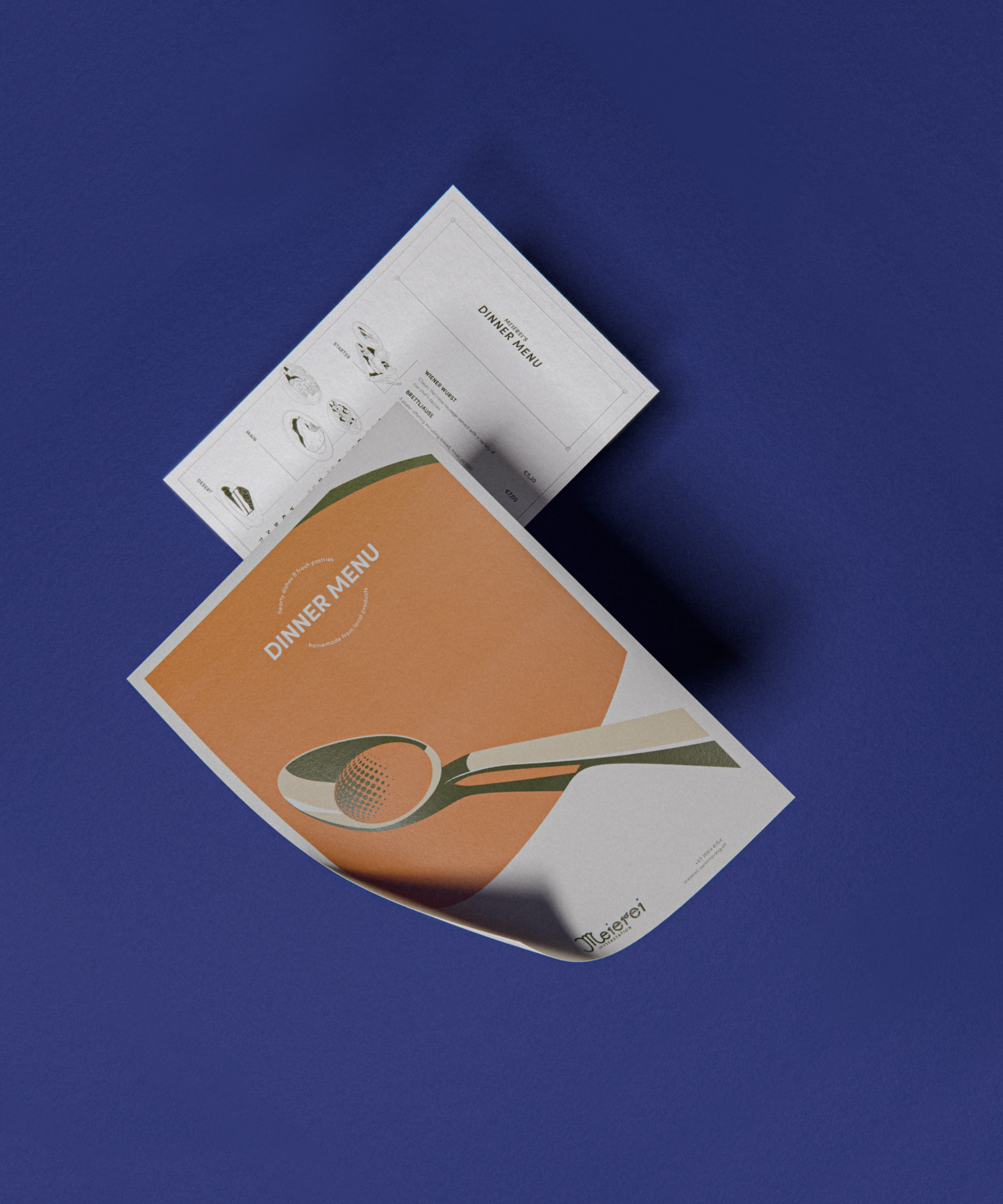 a closeup of the dinner menu,  featuring my mid-century illustration on the front, of a soup bowl with a spoon resting in it. 