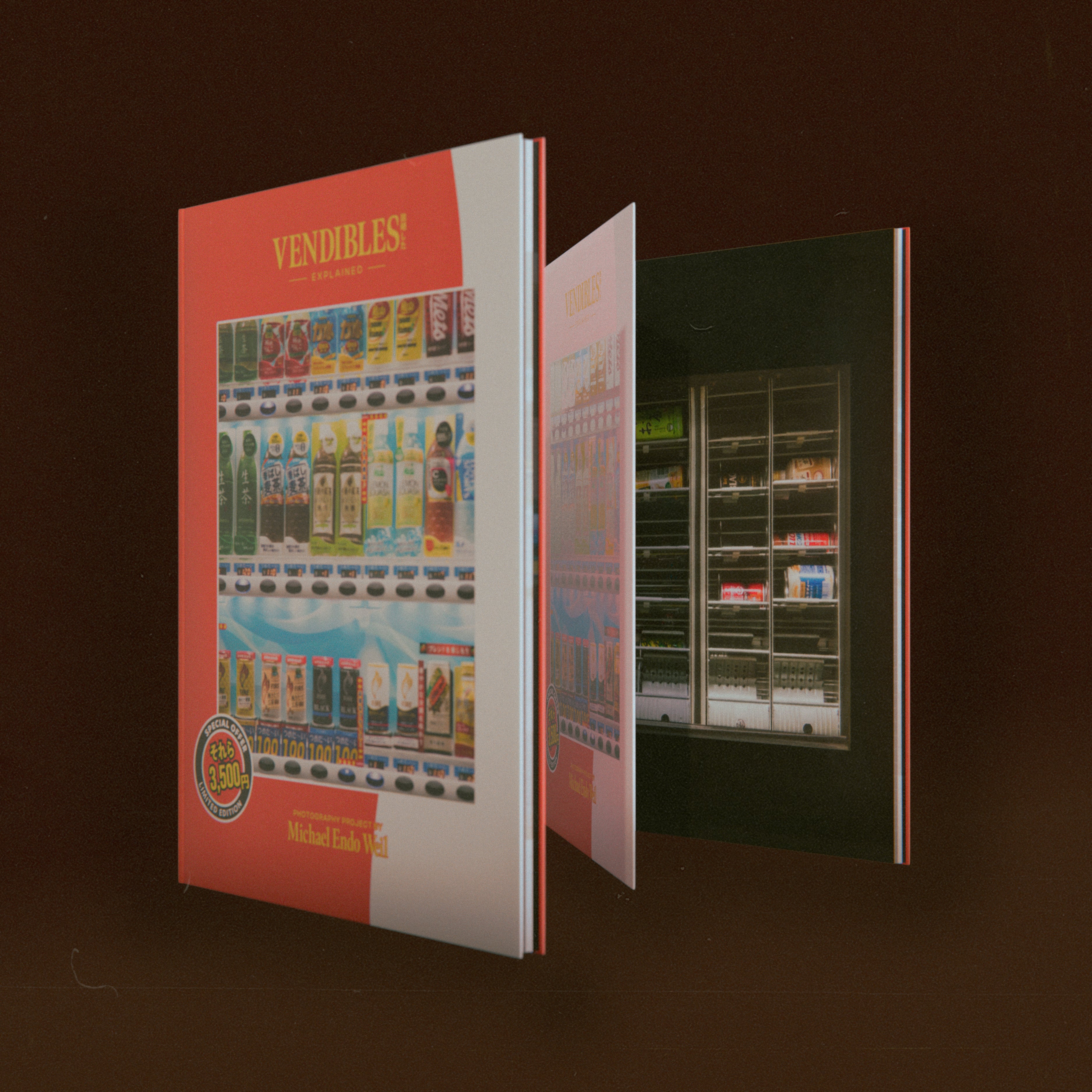 a shot showing two of the Vendibles book covers and first page. the cover which features the window of a vending machine is opened, and beneath, on the first page, the intirior of a vending machine is shown.